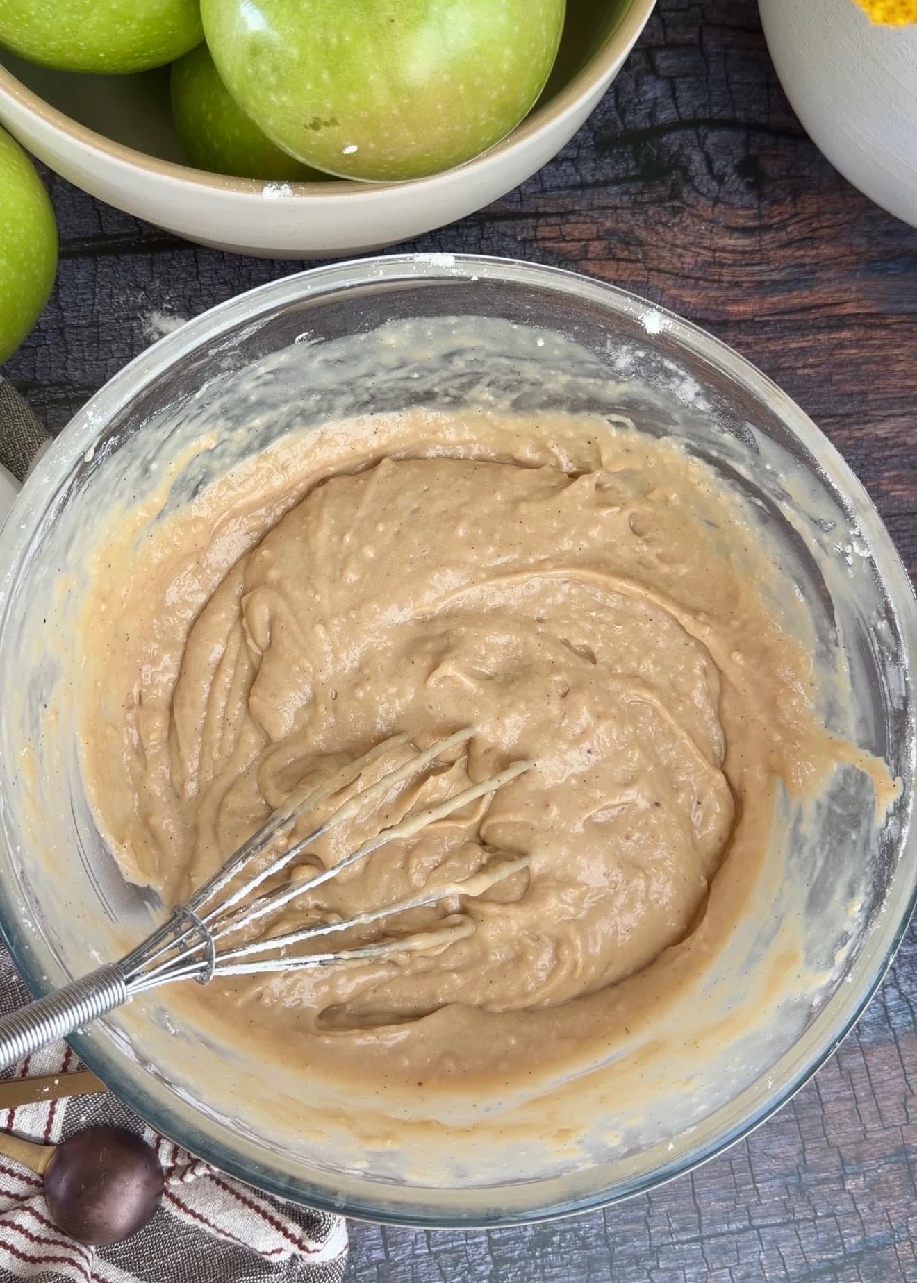 Smooth, thick cake batter in a glass bowl