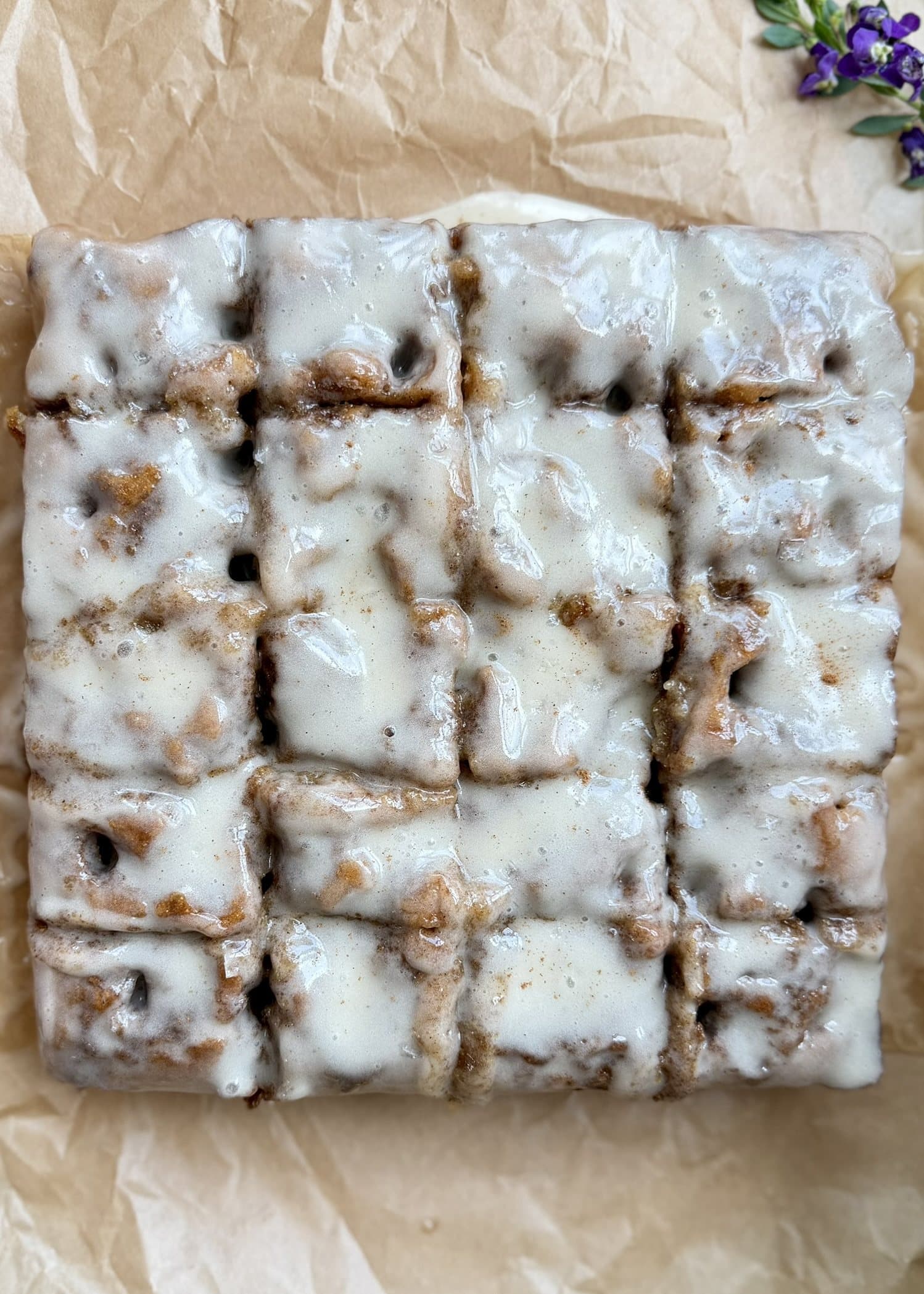 Warm Banana Cornmeal Cinnamon Roll Poke Cake, finished and ready to serve