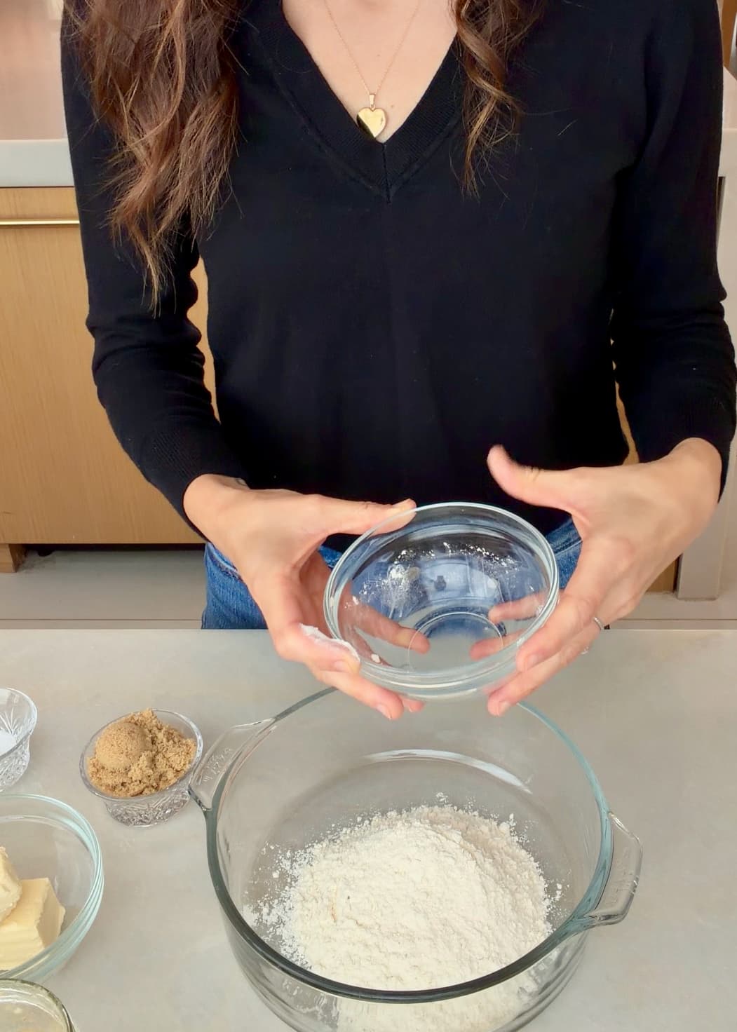 Flour in a bowl with crumble ingredients beside it