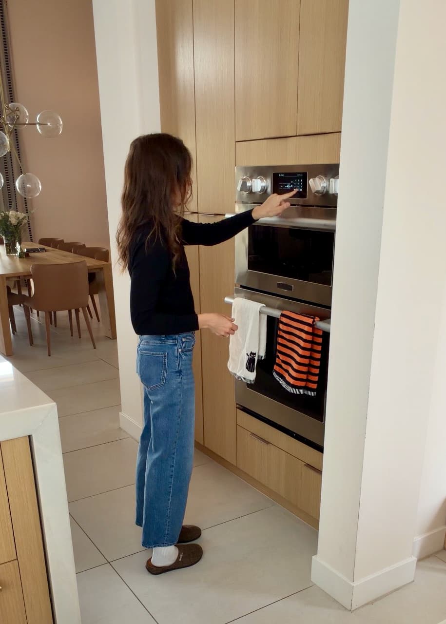 Angela checking the controls on her wall oven