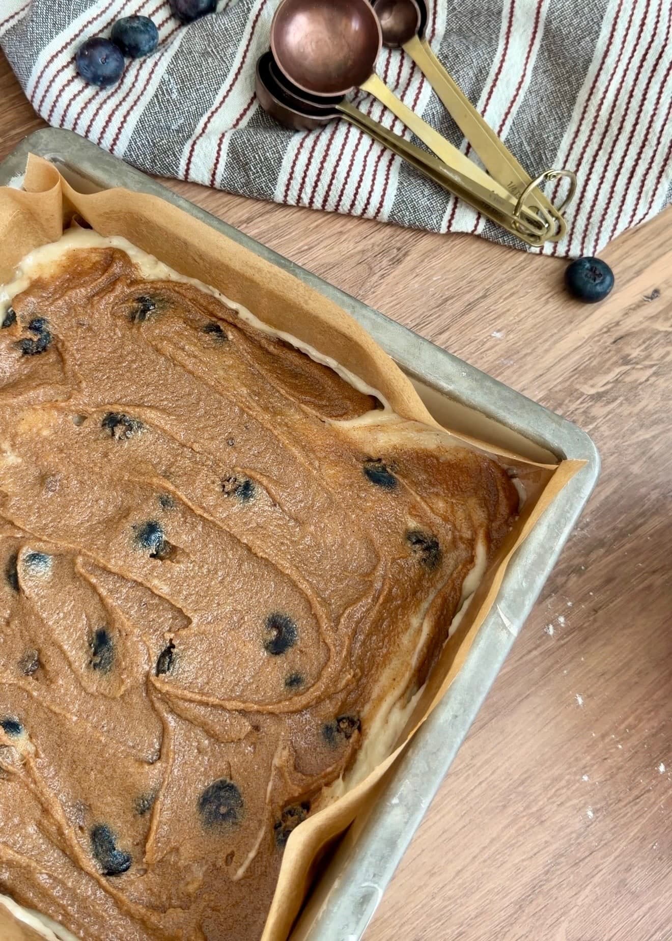 Cinnamon filling spread across the first blueberry layer