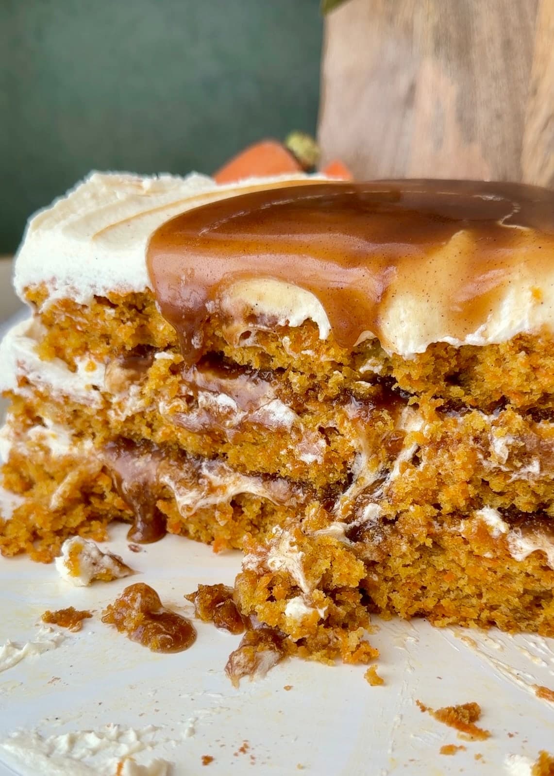 Close view of carrot cake layers with cinnamon filling and cream cheese frosting