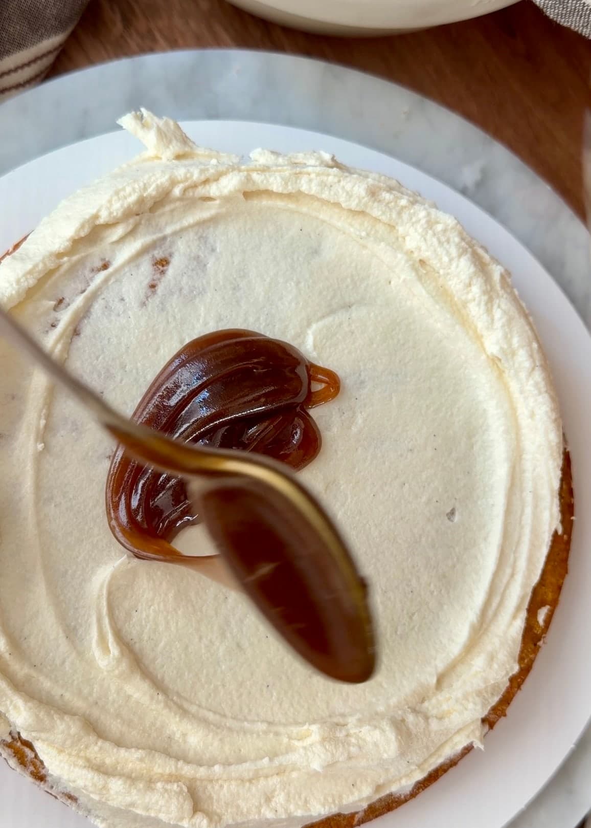 Cinnamon roll lava spooned inside the frosting border