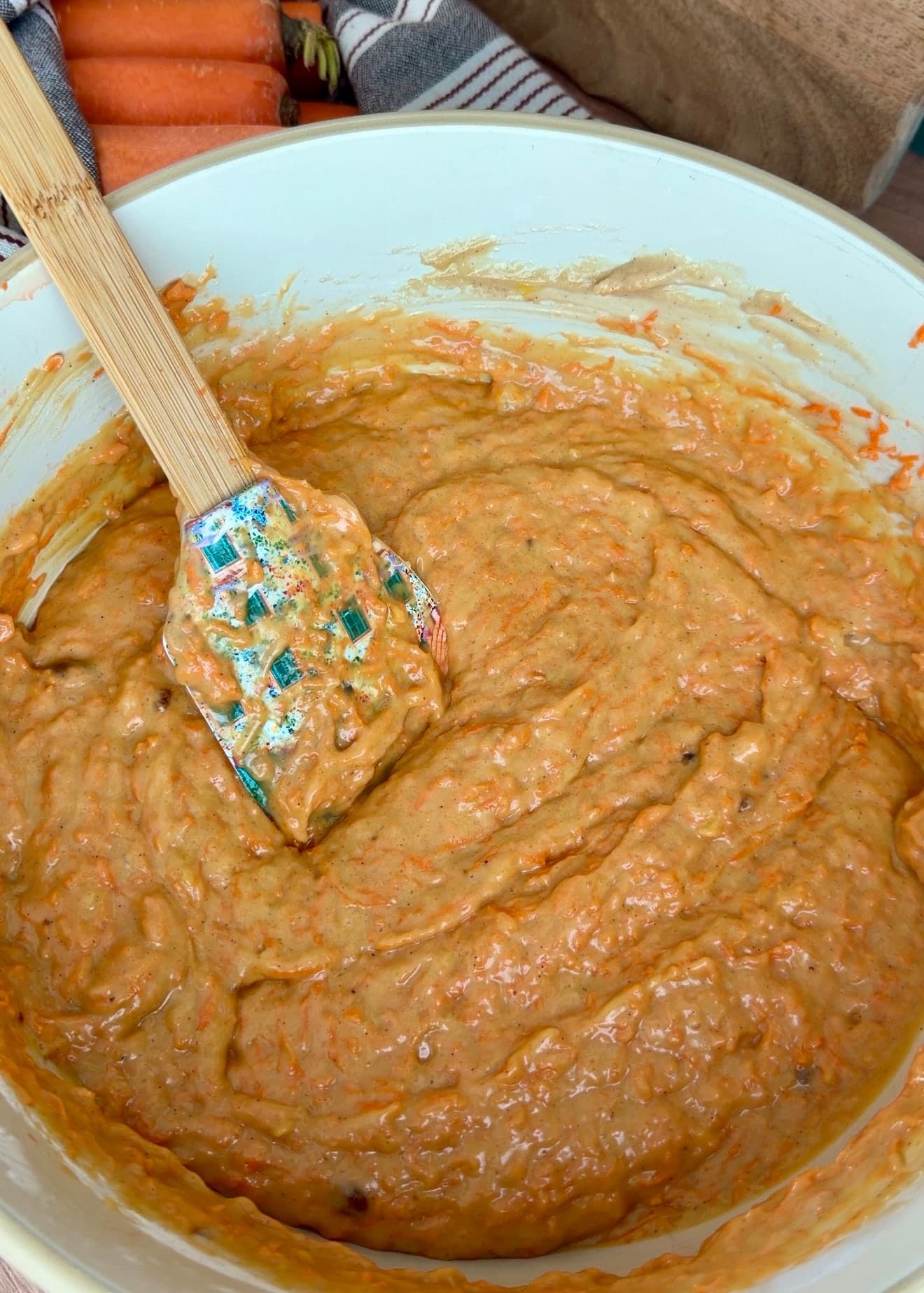 Finished carrot cake batter with fine carrot shreds throughout