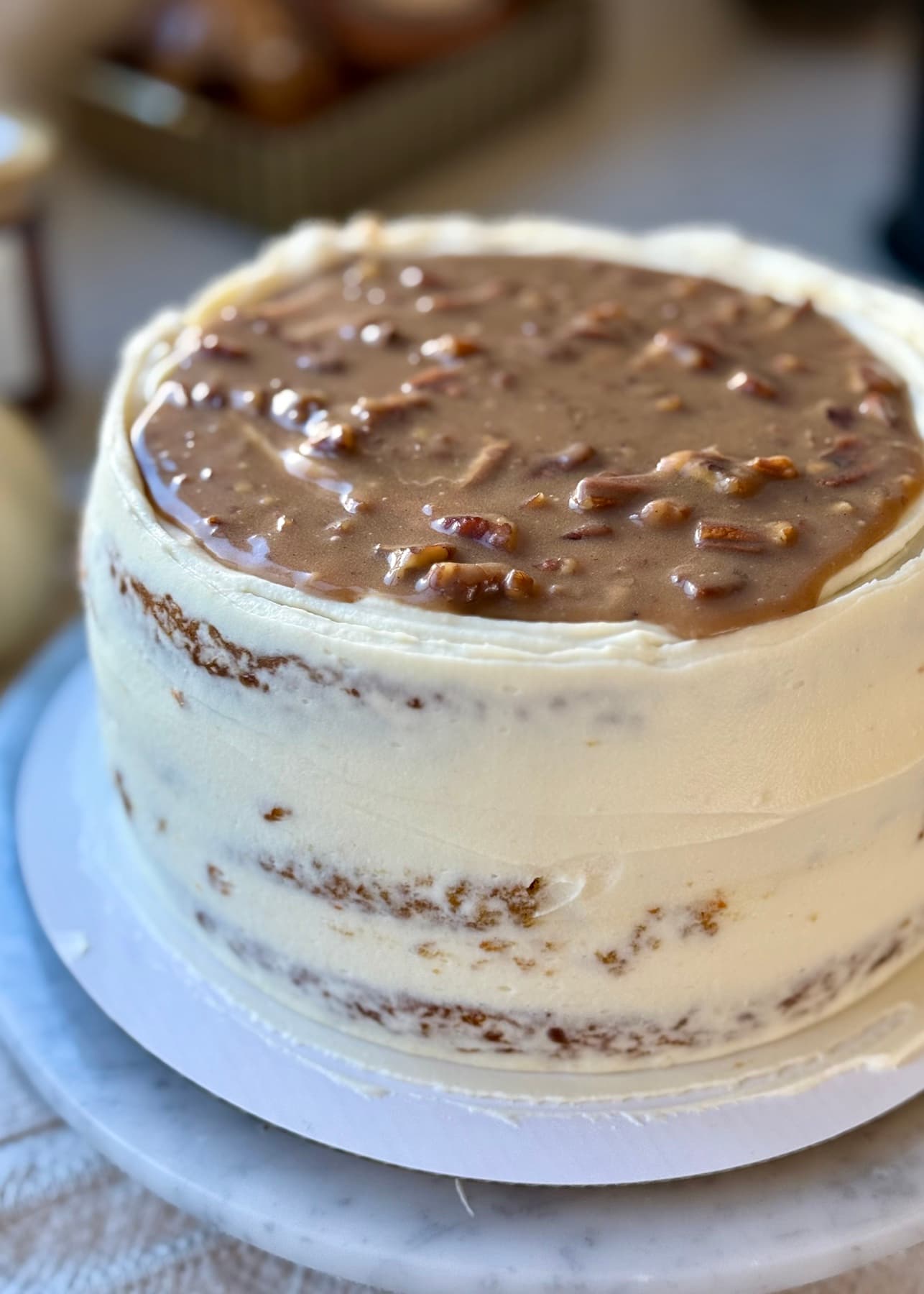Whole Carrot Praline Cheesecake Cake finished with pecan caramel