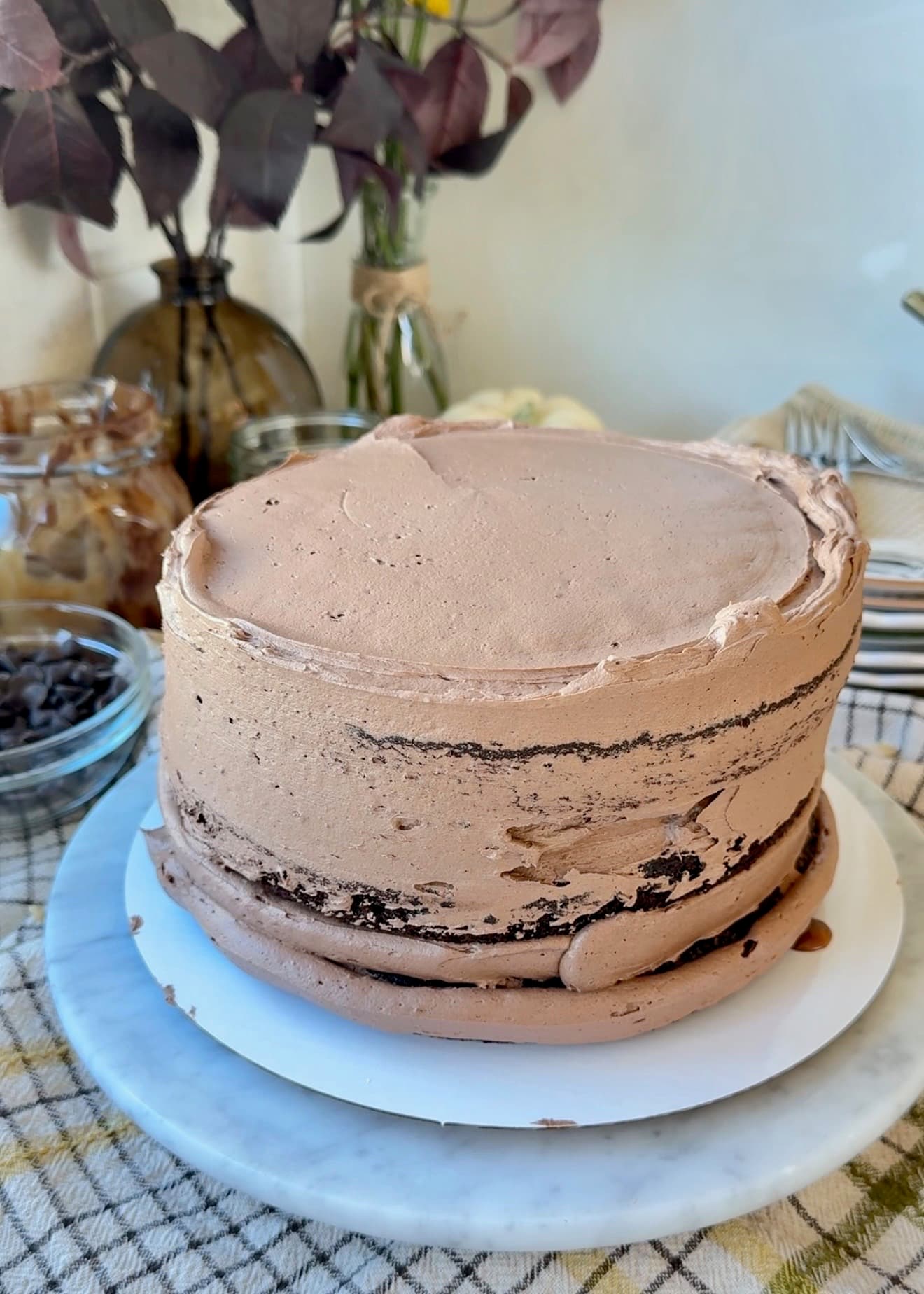 Three-layer chocolate cake coated with chocolate buttercream