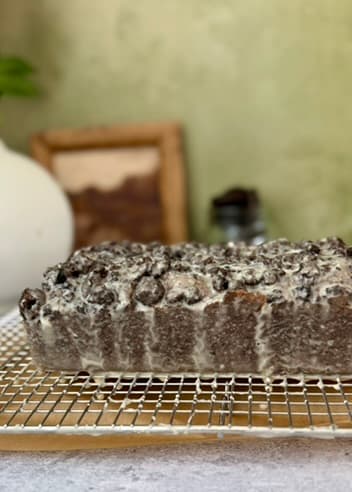 Glazed loaf viewed from the side on a rack