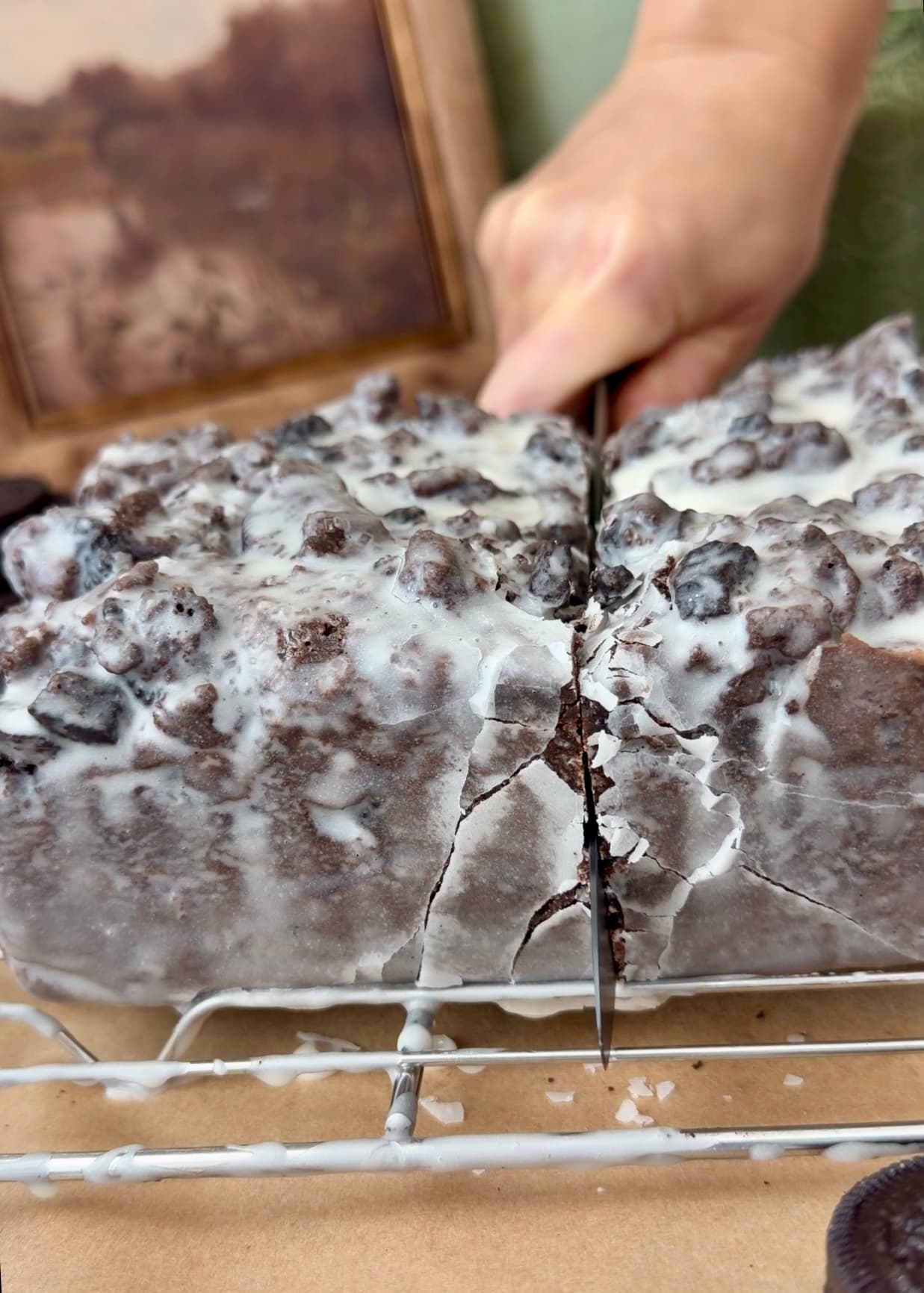Knife cutting into the glazed loaf