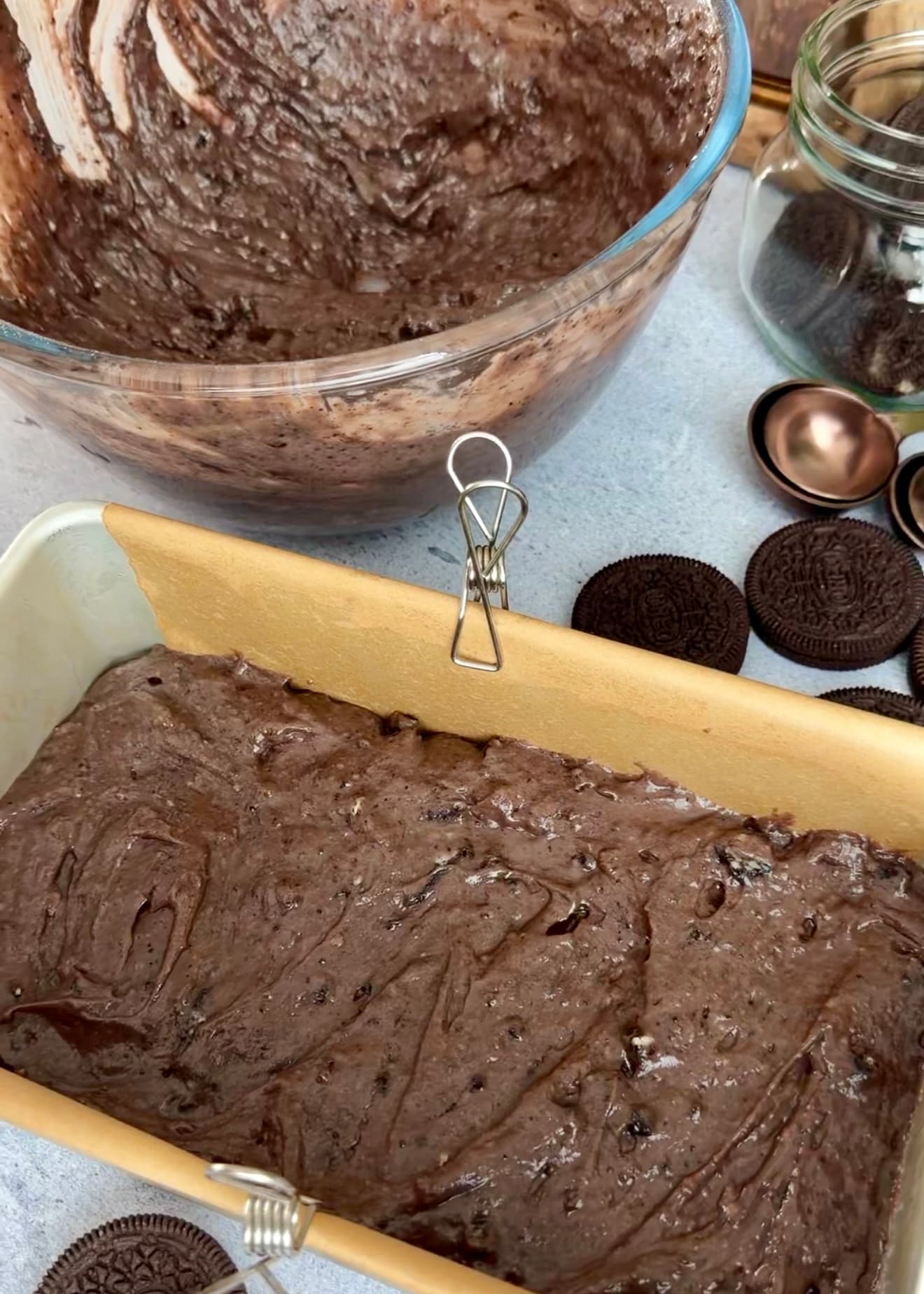 First layer of chocolate batter spread in the pan