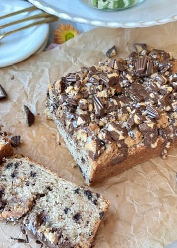 Chocolate Peanut Butter Cup Donut Loaf with a thick slice cut from the finished loaf