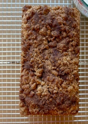 Baked cinnamon streusel loaf on a wire rack