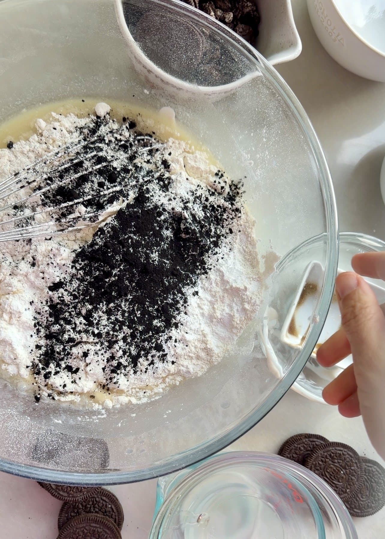 Dark cookie crumbs added to the cake mixture