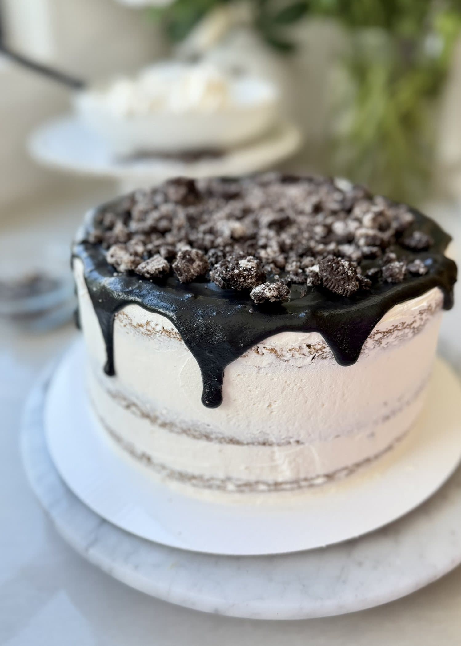 Finished cake topped with dark lava and cookie crumble