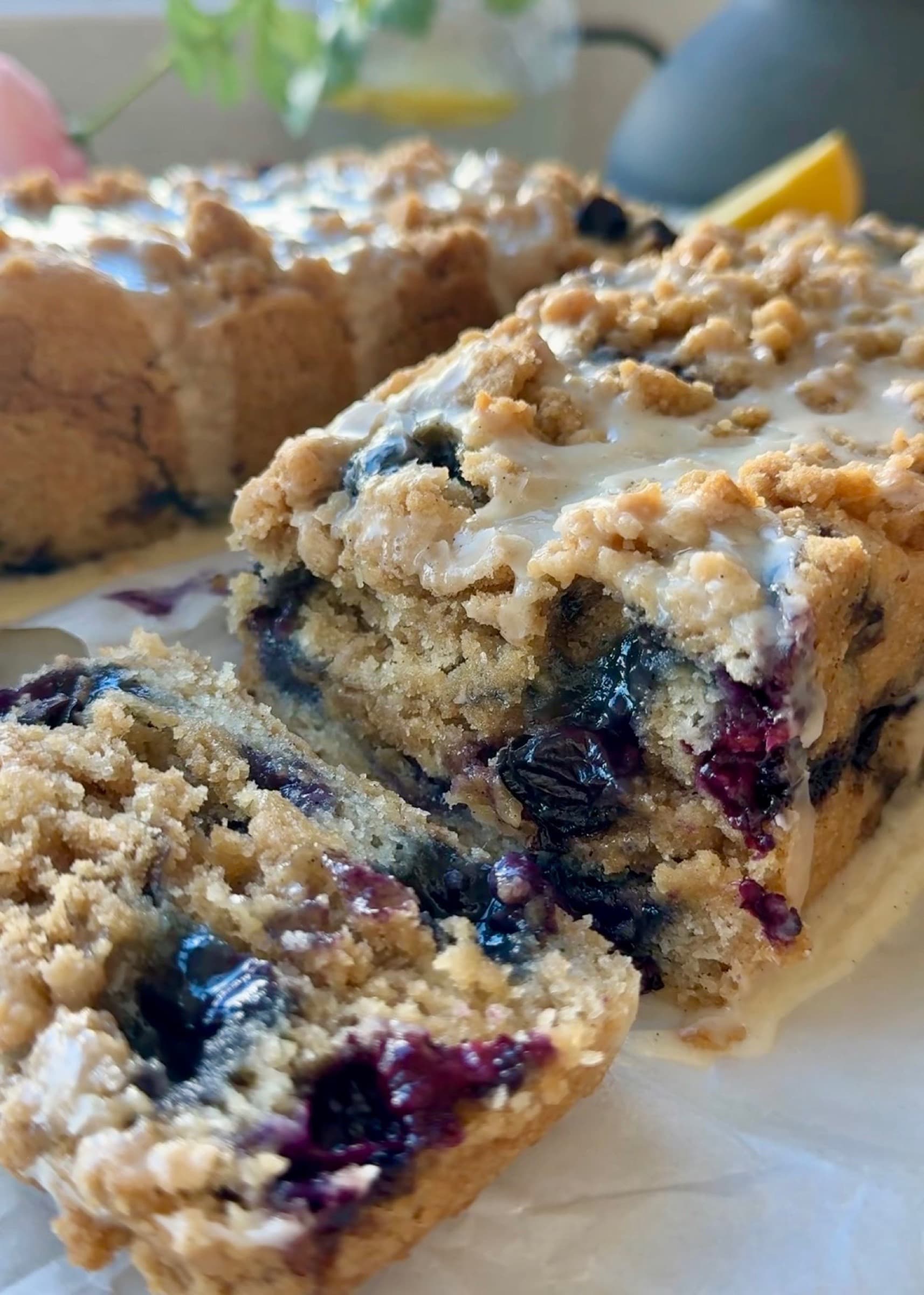 Sliced Gluten-Free Blueberry Coffee Cake showing fresh blueberries and a streusel seam