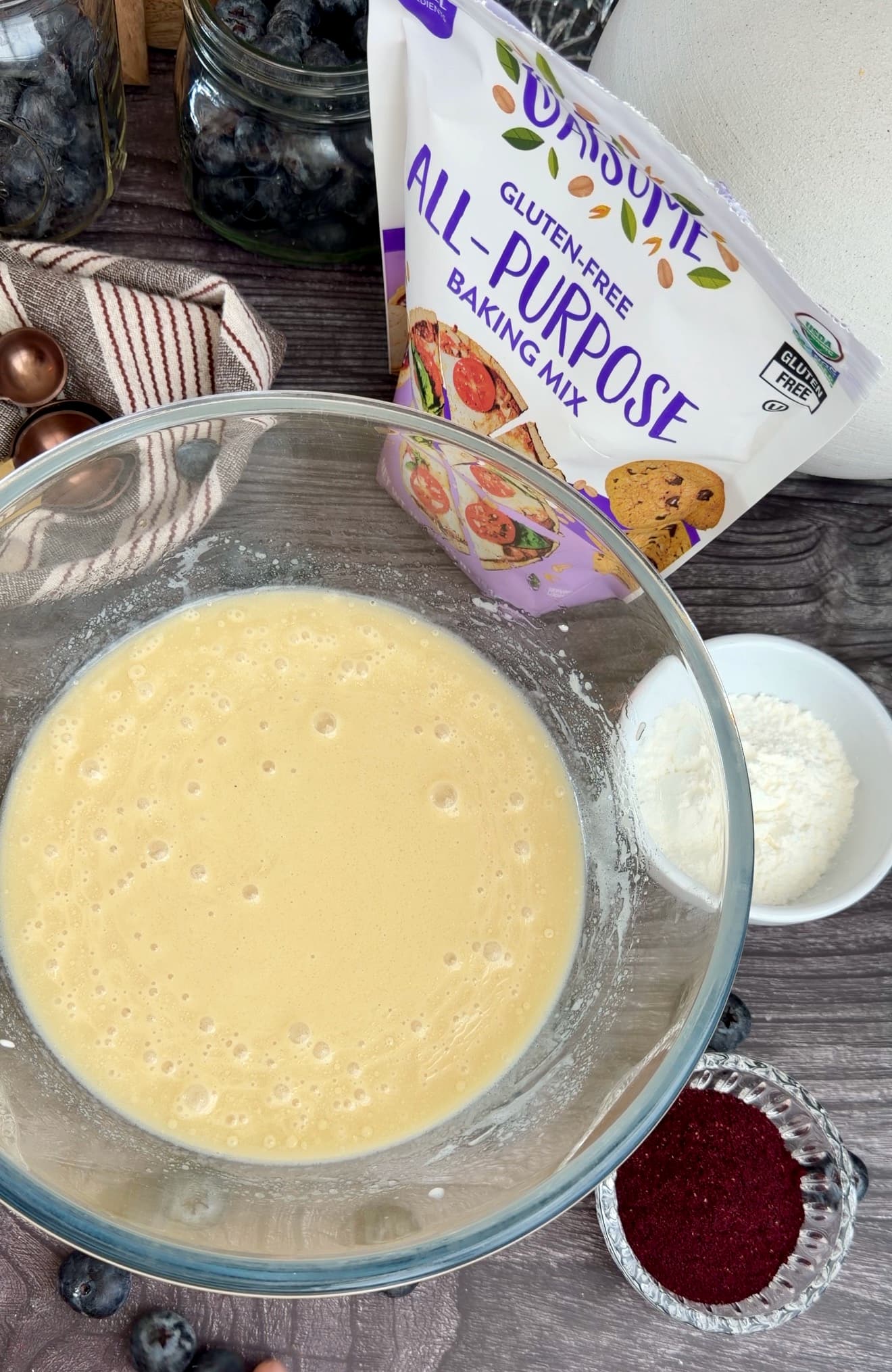Smooth pale yellow wet ingredients in a glass bowl