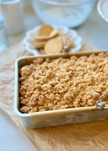 Golden cookie streusel covering a loaf in its pan
