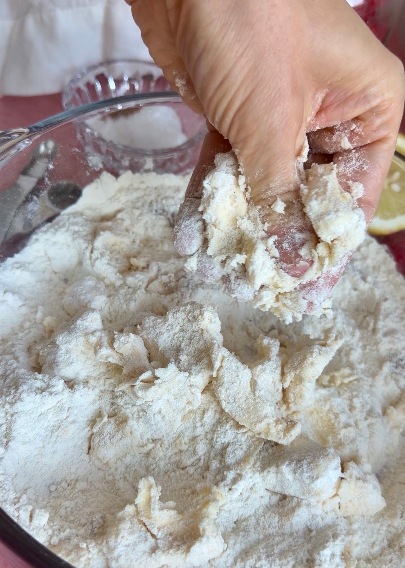 Cold butter being worked into streusel for Lemon Raspberry Donut Loaf