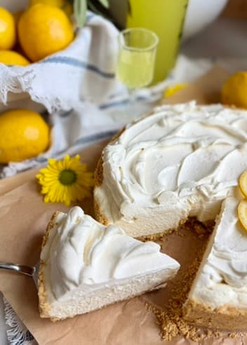 Limoncello Cheesecake Mousse with one slice lifted from the graham cracker crust