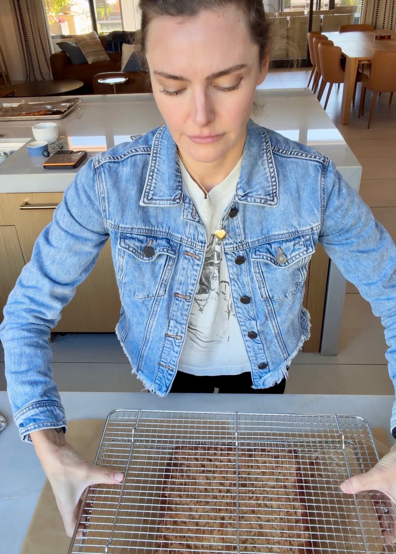 A second wire rack positioned across the top of the baked coffee cake