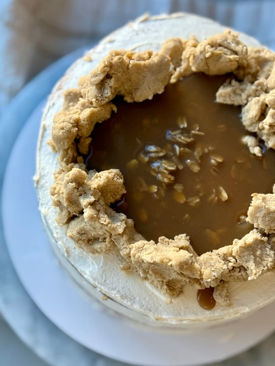 Finished oatmeal cookie dough lava cake topped with caramel, oats, and cookie-dough pieces