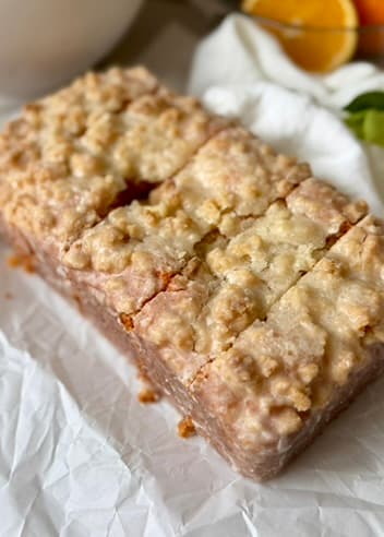 Close view of a glazed Orange Old-Fashioned Donut Loaf with streusel