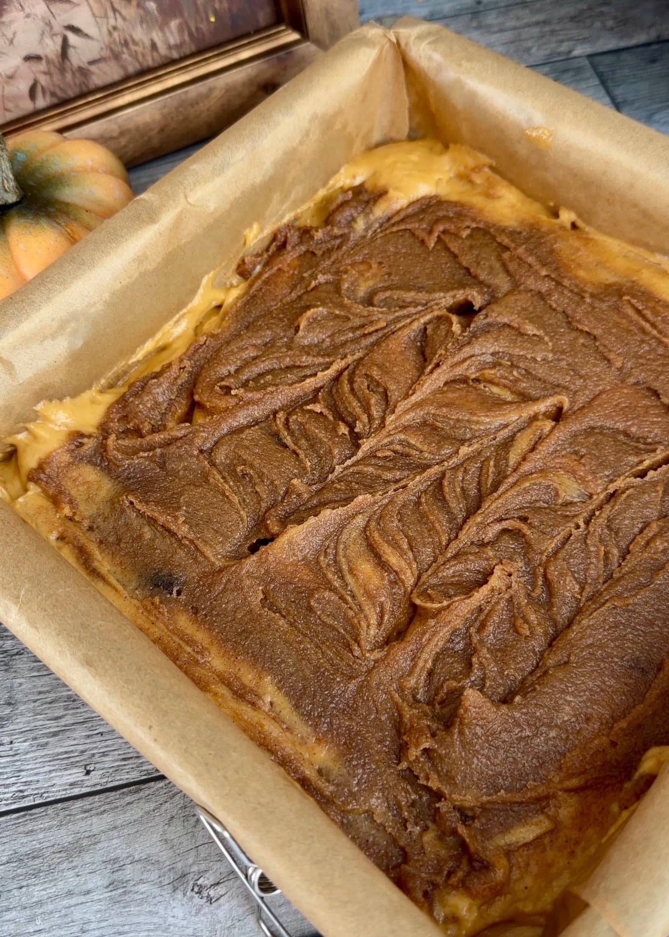 Shallow curved knife trails through the cinnamon layer