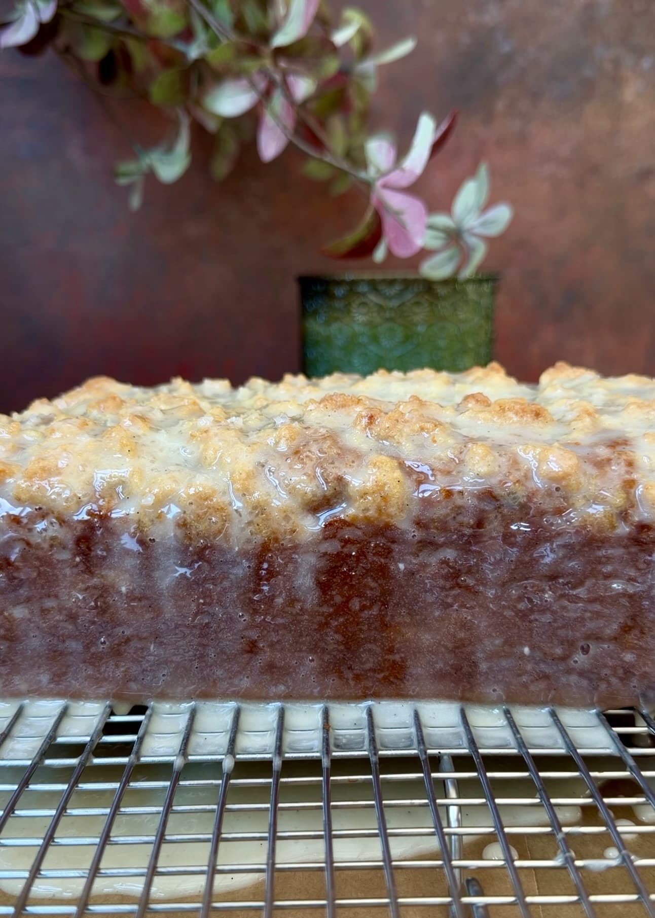 Finished glazed Pumpkin Spice Old-Fashioned Donut Loaf on a cooling rack
