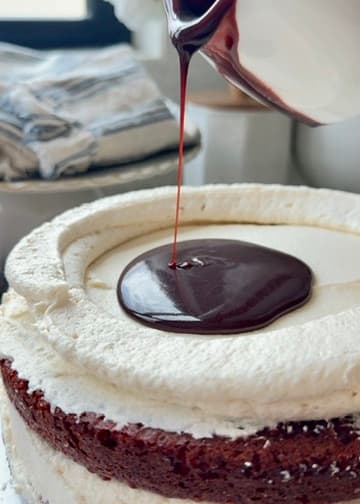 Red velvet lava pouring inside a cream cheese buttercream ring