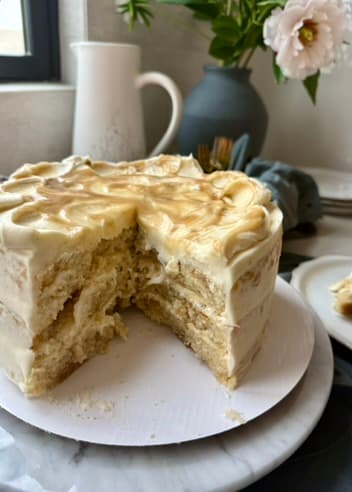 Finished salted caramel blondie cheesecake cake with a slice removed