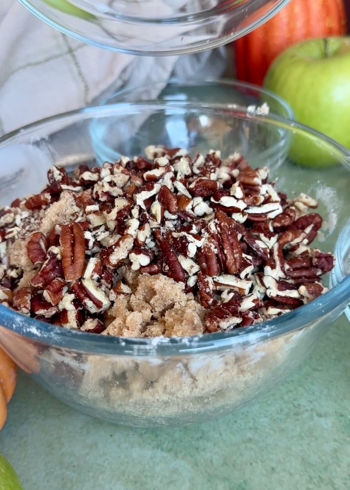 Pecans being folded into brown sugar streusel