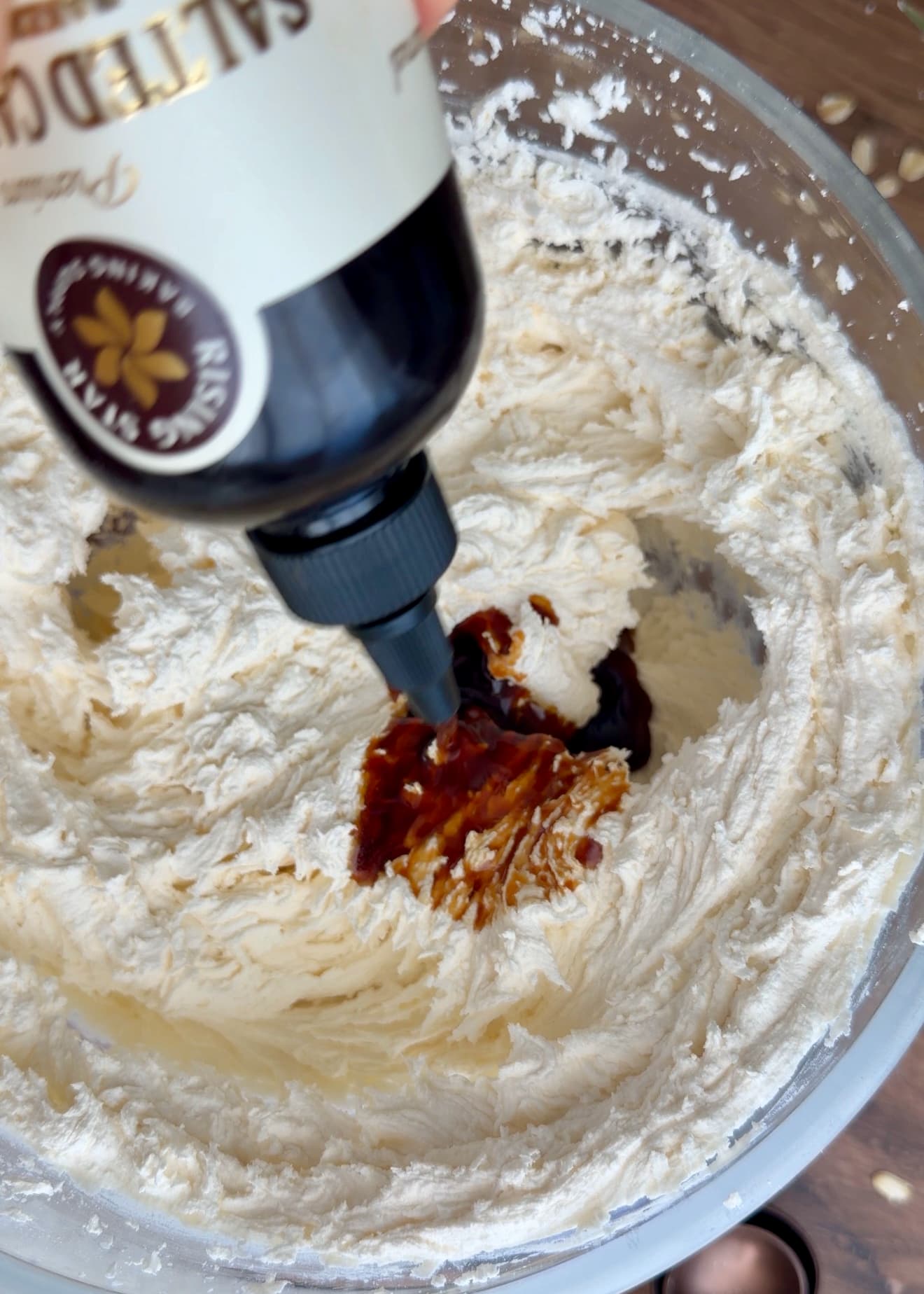 Rising Star salted caramel syrup being poured into the cream filling