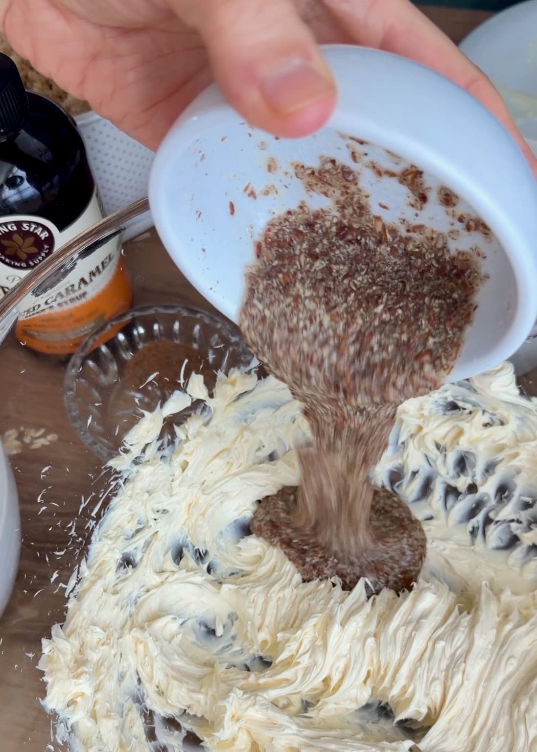 Thickened flax mixture being poured into the cookie mixture