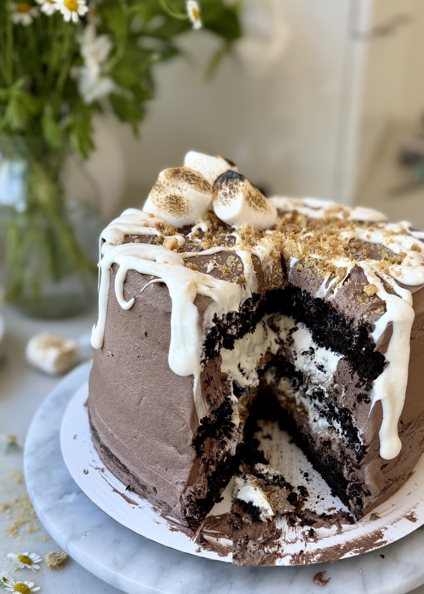 S’mores Lava Cake with a slice removed to show marshmallow filling and Golden Oreo crunch