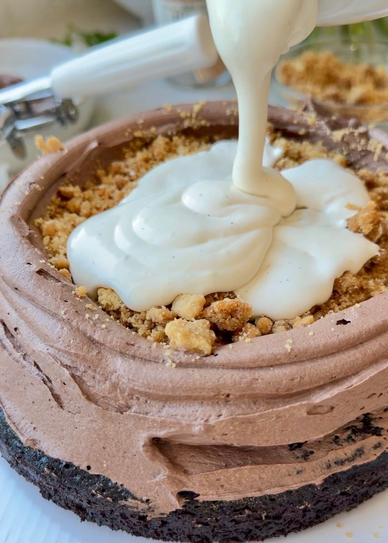 Vanilla marshmallow lava filling poured into a chocolate buttercream dam