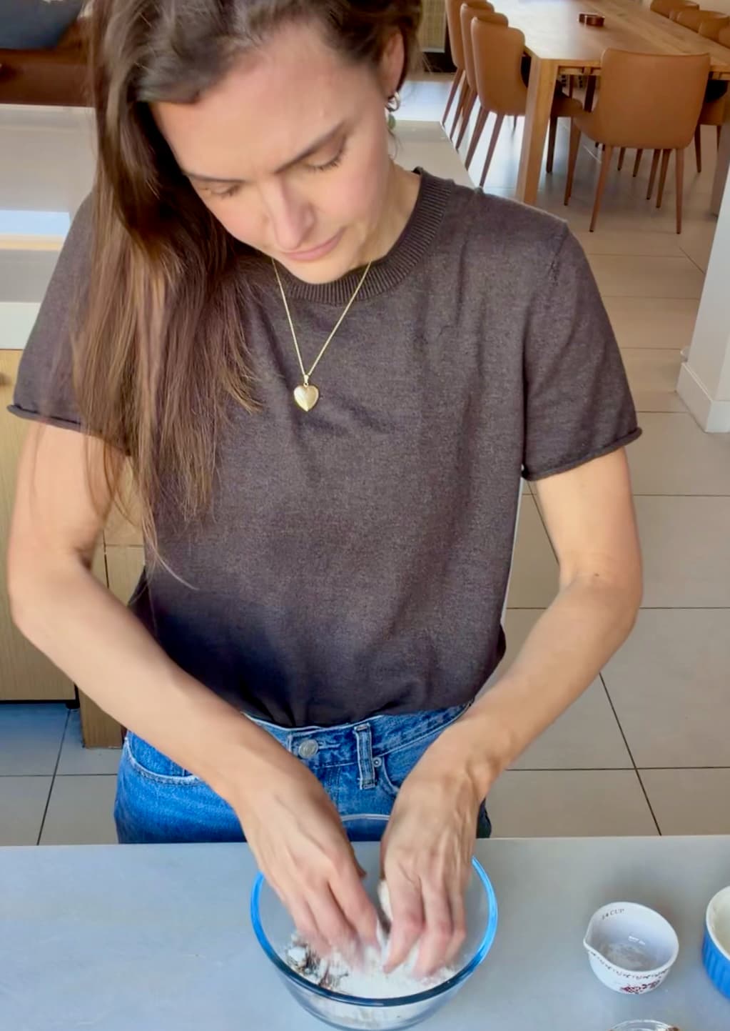 Angela working the crumble ingredients together with her fingertips