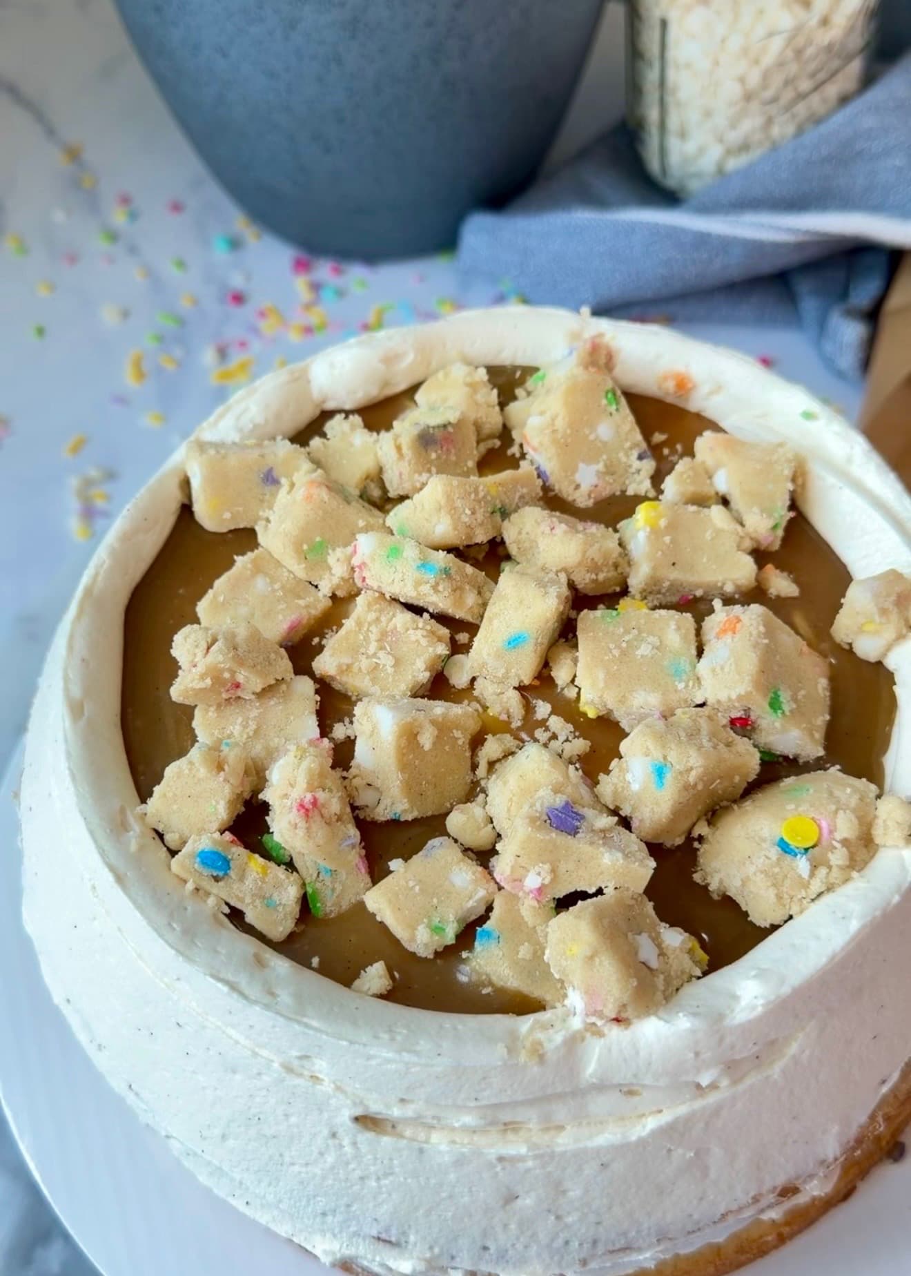Cookie-dough pieces arranged over lava inside the buttercream border