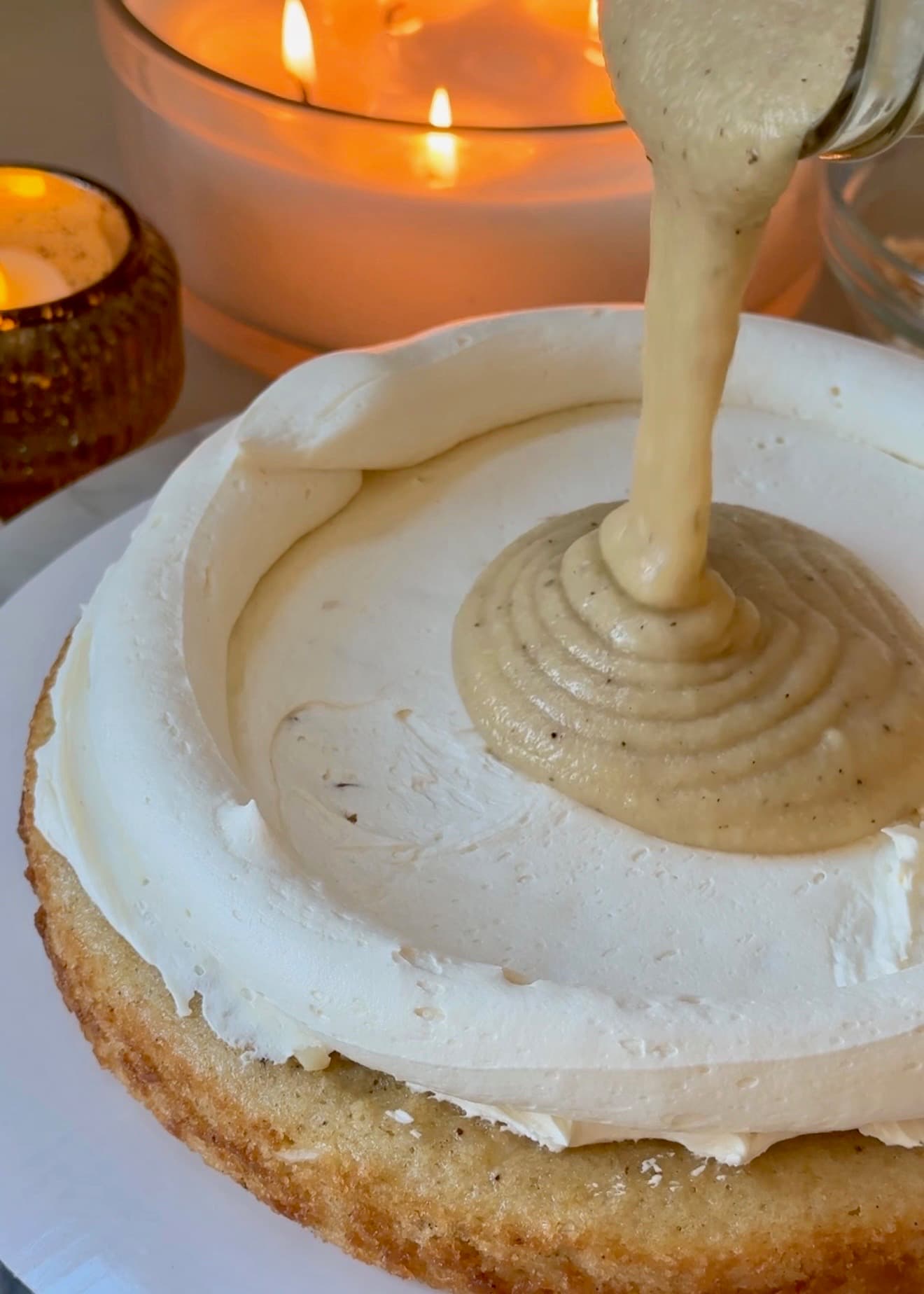Vanilla-white chocolate lava pouring into a vanilla buttercream dam