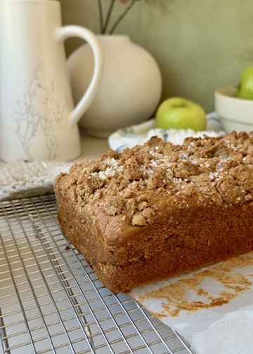 Freshly baked Apple Fritter Old-Fashioned Donut Loaf cooling on a wire rack