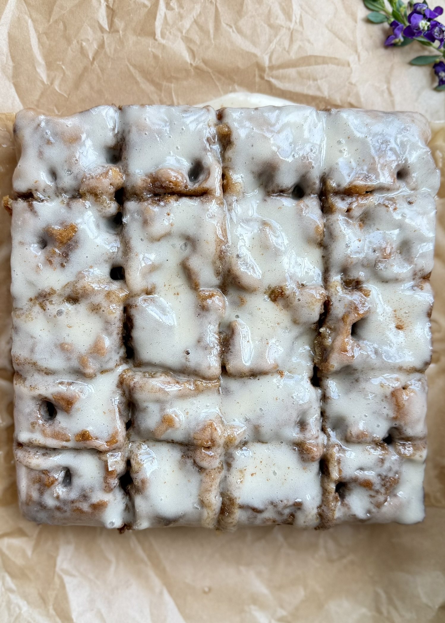 Warm Banana Cornmeal Cinnamon Roll Poke Cake, finished and ready to serve