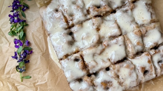 Warm Banana Cornmeal Cinnamon Roll Poke Cake