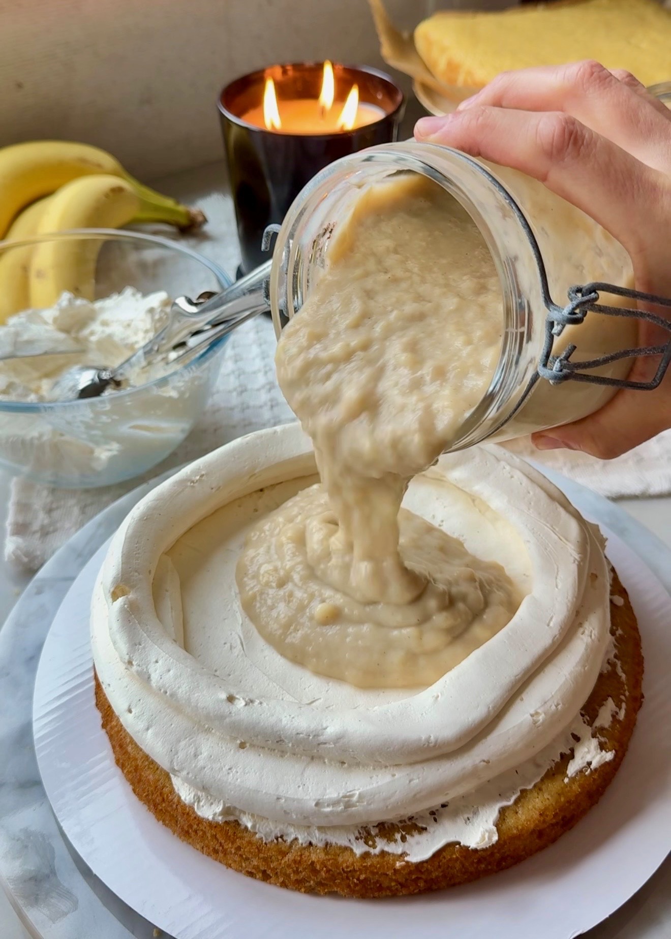 Banana cream pouring into a vanilla buttercream dam