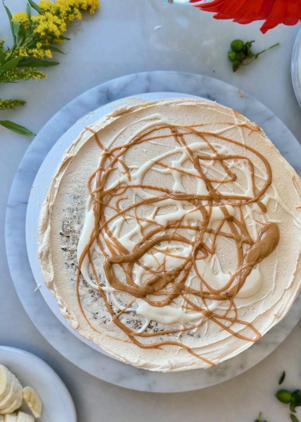 Finished banana fluffernutter cake drizzled with peanut butter and marshmallow