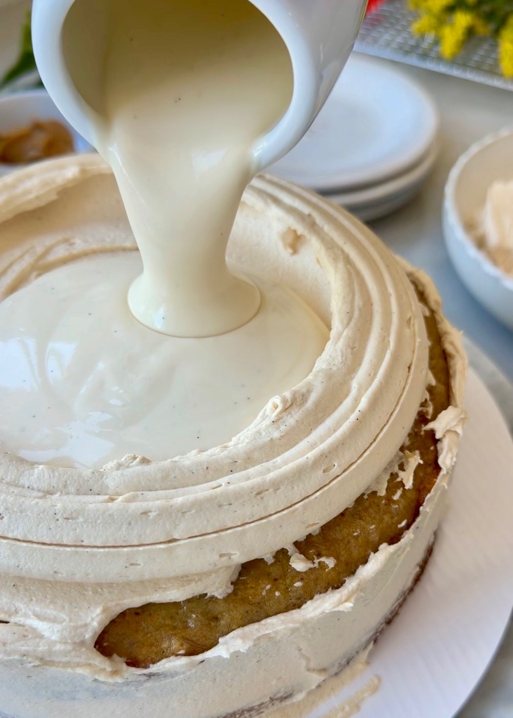 Marshmallow lava being poured inside a peanut butter buttercream dam