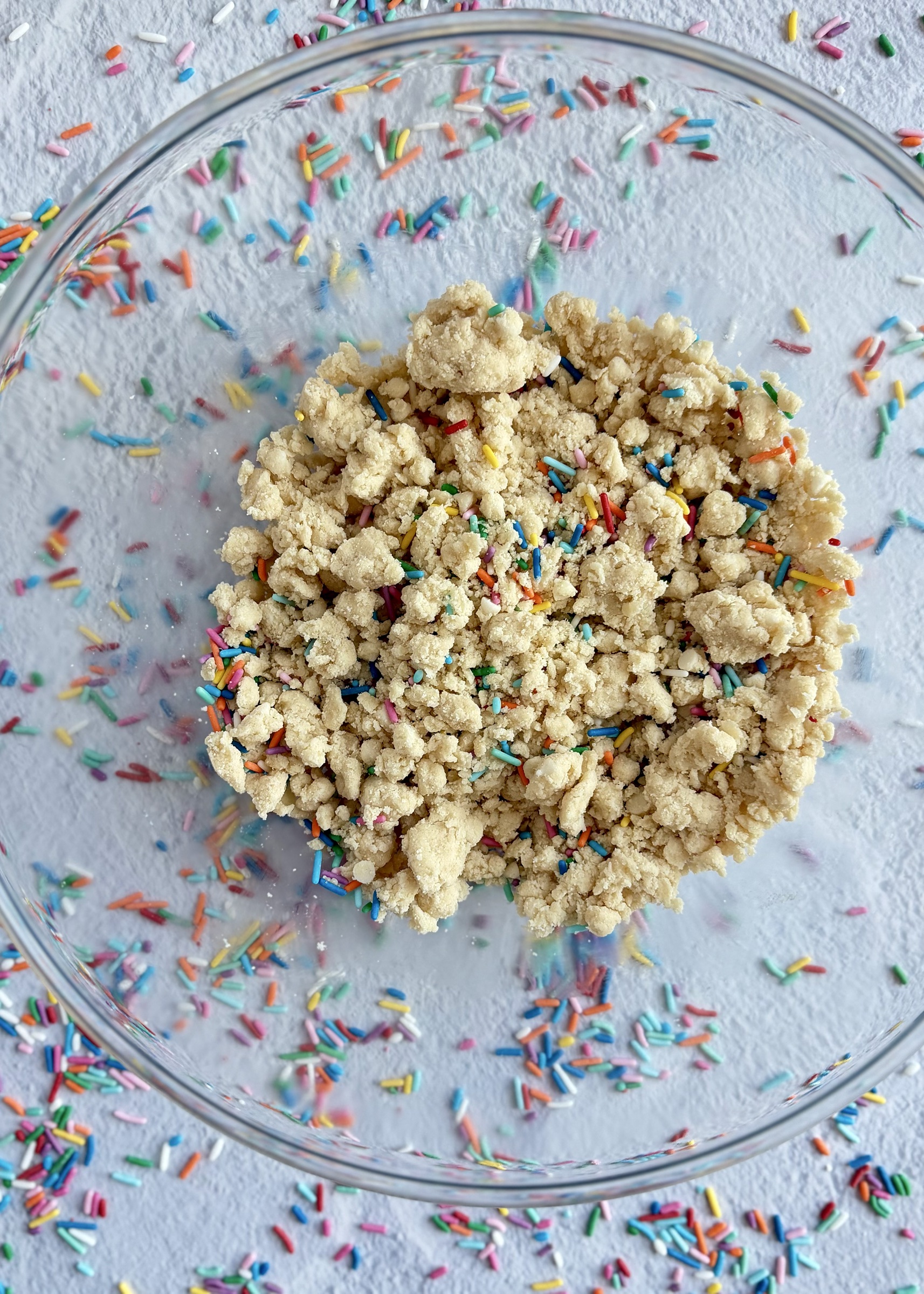 Funfetti cookie dough broken into small pieces