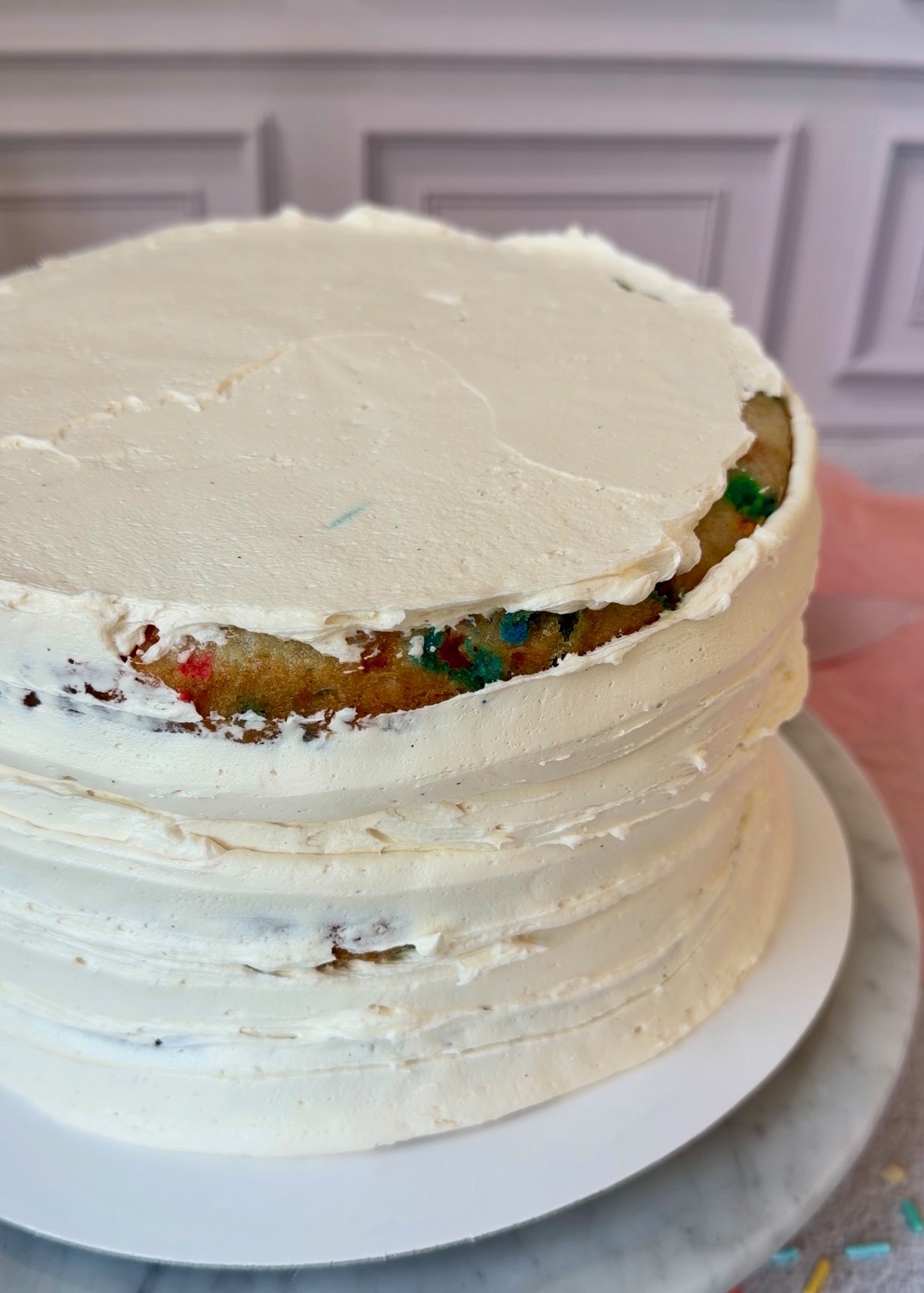 Stacked Cake Batter Lava Cake covered with a thin crumb coat