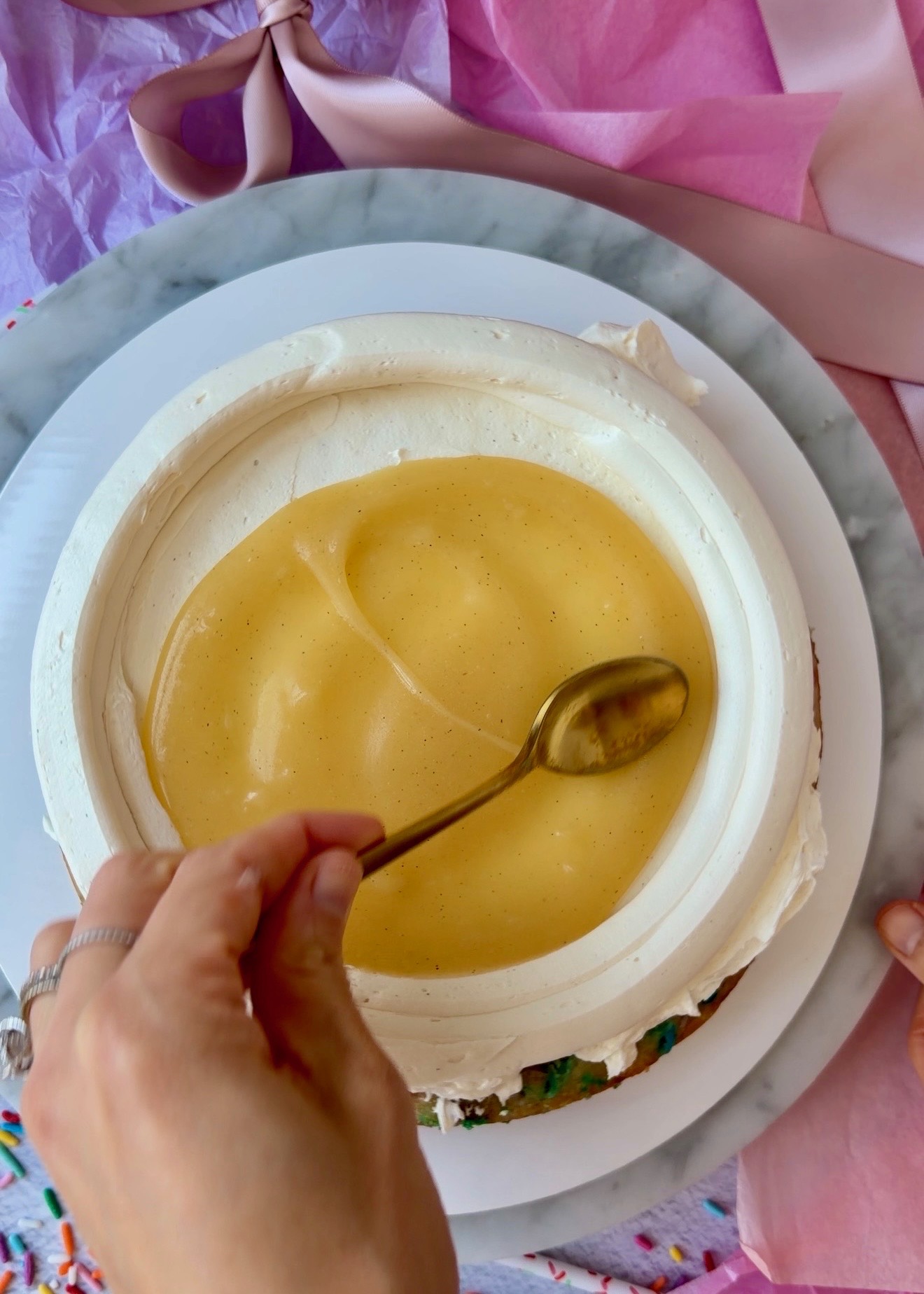 Golden cake batter lava spread inside a buttercream dam