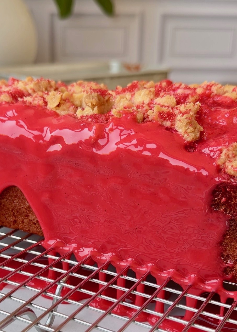 Close view of glossy red crackle glaze and streusel on Cherry Old-Fashioned Donut Loaf
