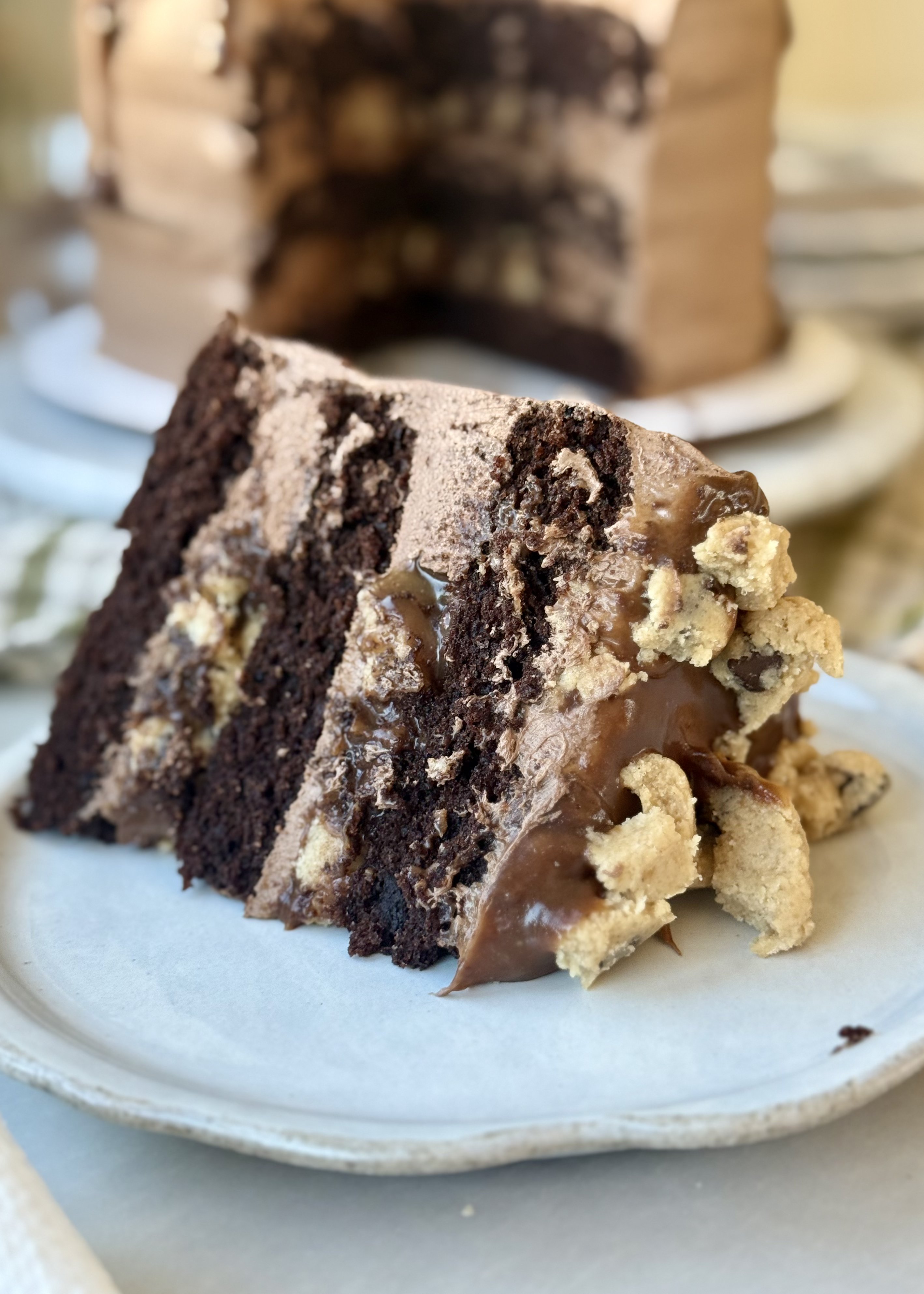Slice of chocolate cookie dough lava cake with molten filling and cookie dough pieces