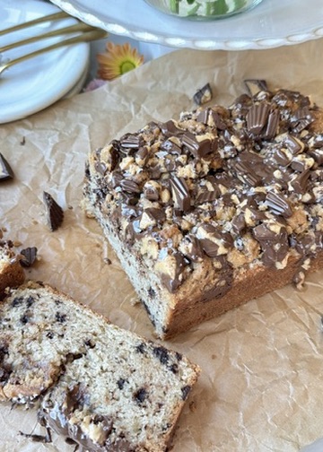 Chocolate Peanut Butter Cup Donut Loaf with a thick slice cut from the finished loaf