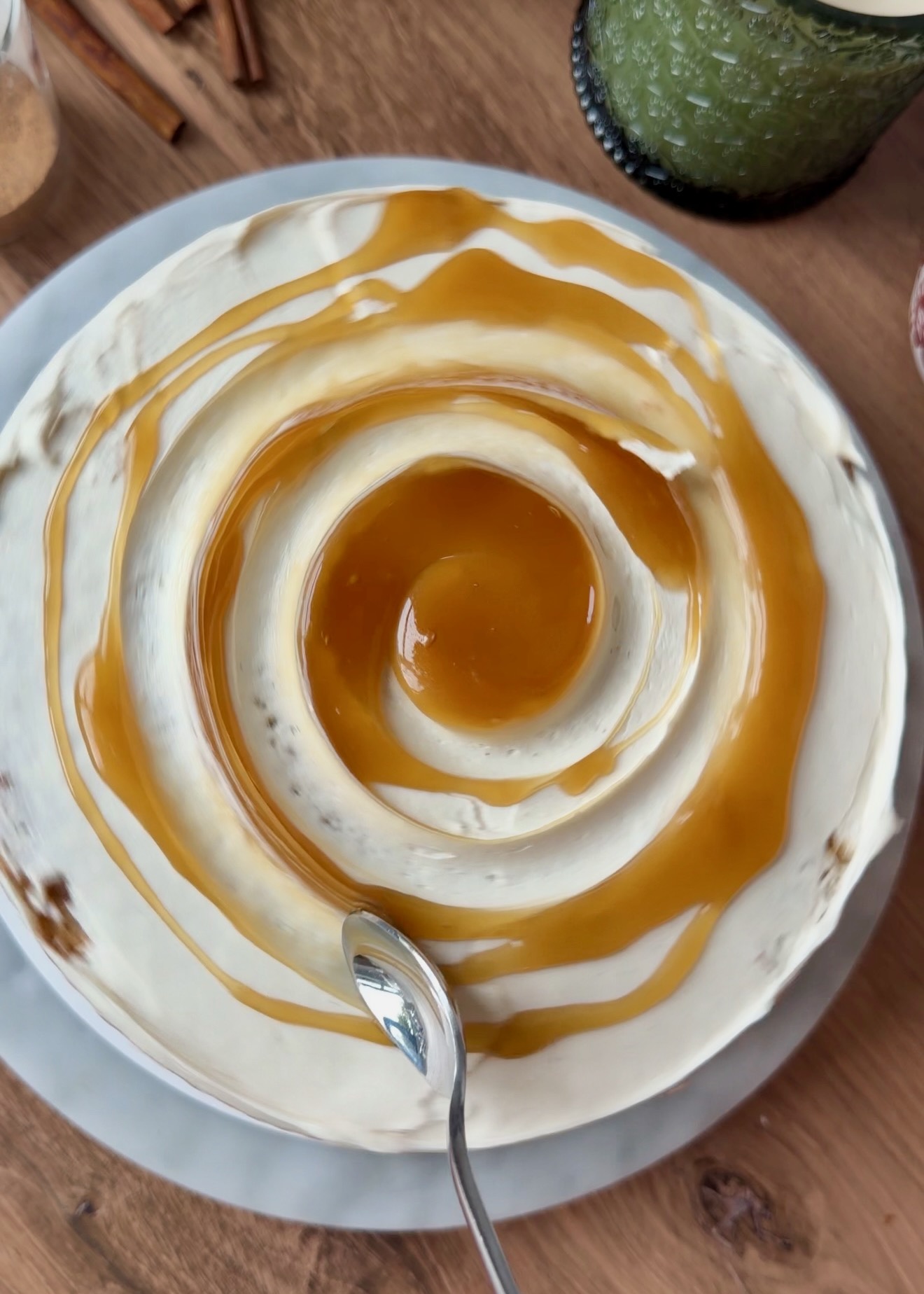 Cinnamon filling swirled over the frosted cake